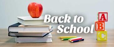 An apple on top of a stack of books, colored pencils, and blocks with text: Back to School.